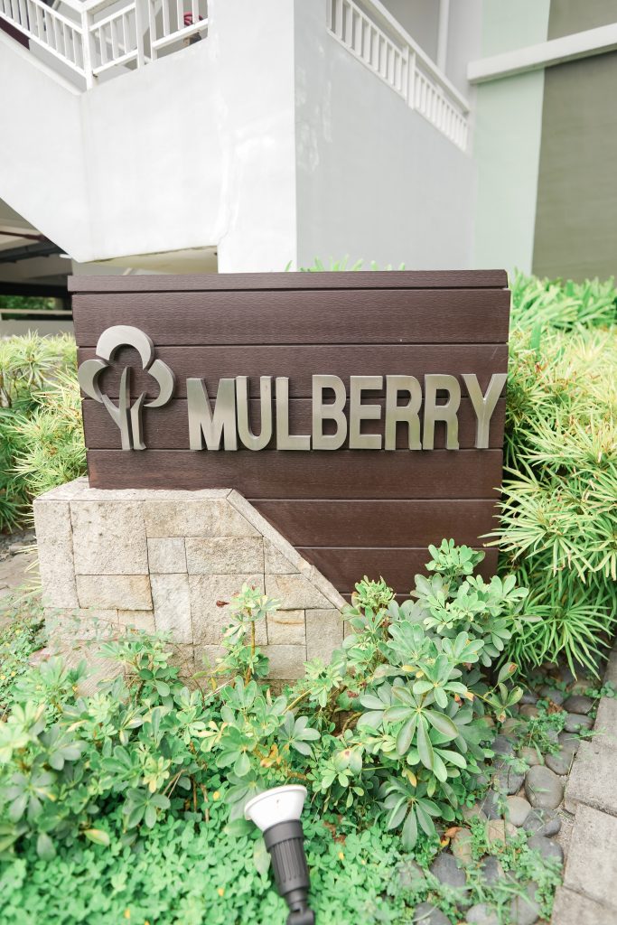 The building name which is called "Mulberry" near the parking lot space.